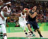 Aug 17, 2016; Rio de Janeiro, Brazil; Argentina point guard Facundo Campazzo (7) drives to the basket against USA center Demarcus Cousins (12) during the men's basketball quarterfinals in the Rio 2016 Summer Olympic Games at Carioca Arena 1. Mandatory Credit: Jeff Swinger-USA TODAY Sports