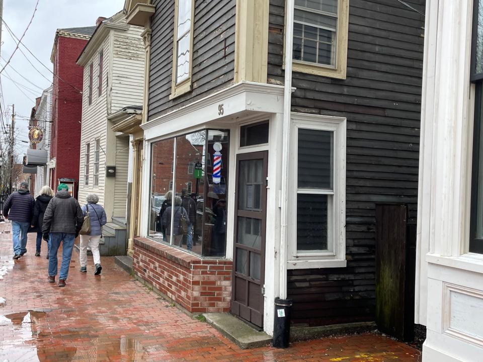 John's Barber Shop was formerly housed at the 95 Daniel St. building in Portsmouth, which the current owner wants to demolish.