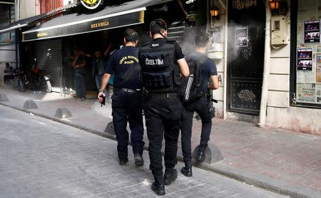 Riot police use rubber pellets to disperse LGBT rights activists during a transgender pride parade, which was banned by the governorship, in central Istanbul, Turkey, June 19, 2016. REUTERS/Osman Orsal