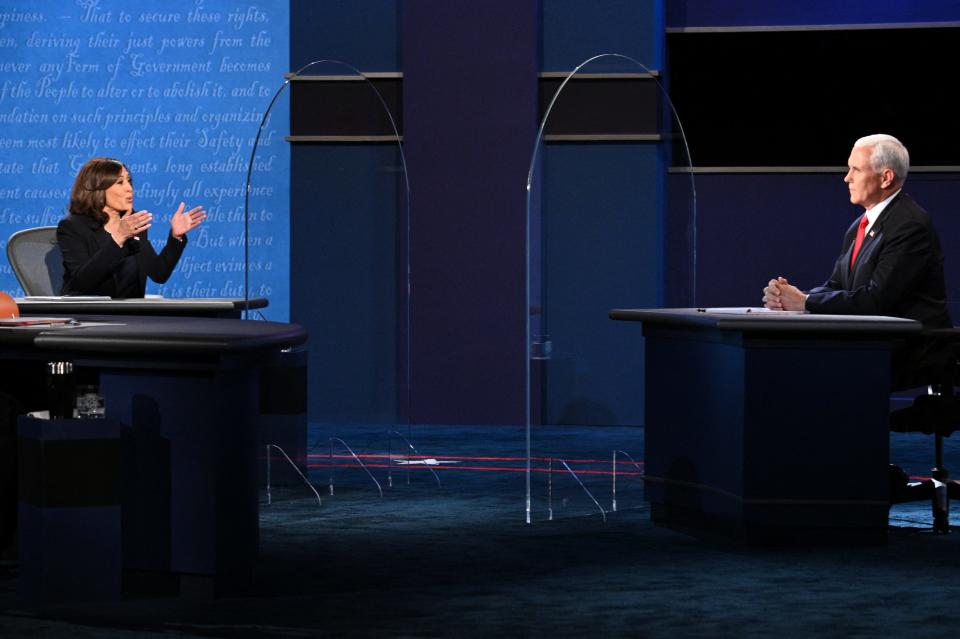 TOPSHOT - US Democratic vice presidential nominee and Senator from California, Kamala Harris (L) gestures toward US Vice President Mike Pence Mike Pence as she speaks during the vice presidential debate in Kingsbury Hall at the University of Utah on October 7, 2020, in Salt Lake City, Utah. (Photo by Robyn Beck / AFP) (Photo by ROBYN BECK/AFP via Getty Images)