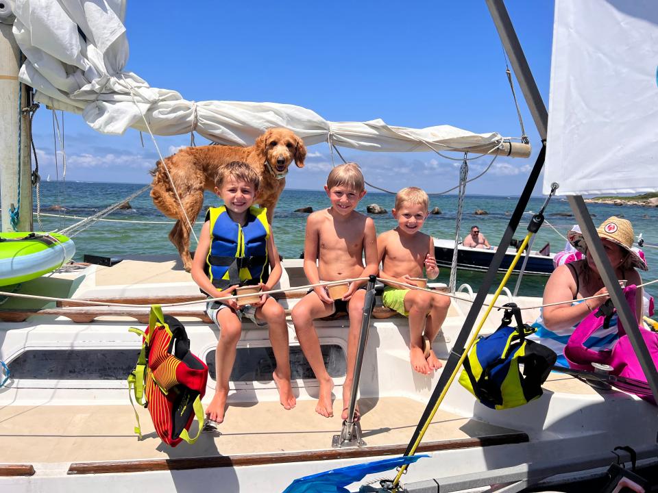 In early July at West Falmouth Harbor, Kirk brothers Keegan, Jameson, and Bodhi are happy to dig into some ice cream.