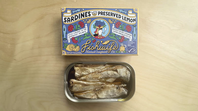 box and open tin of sardines 