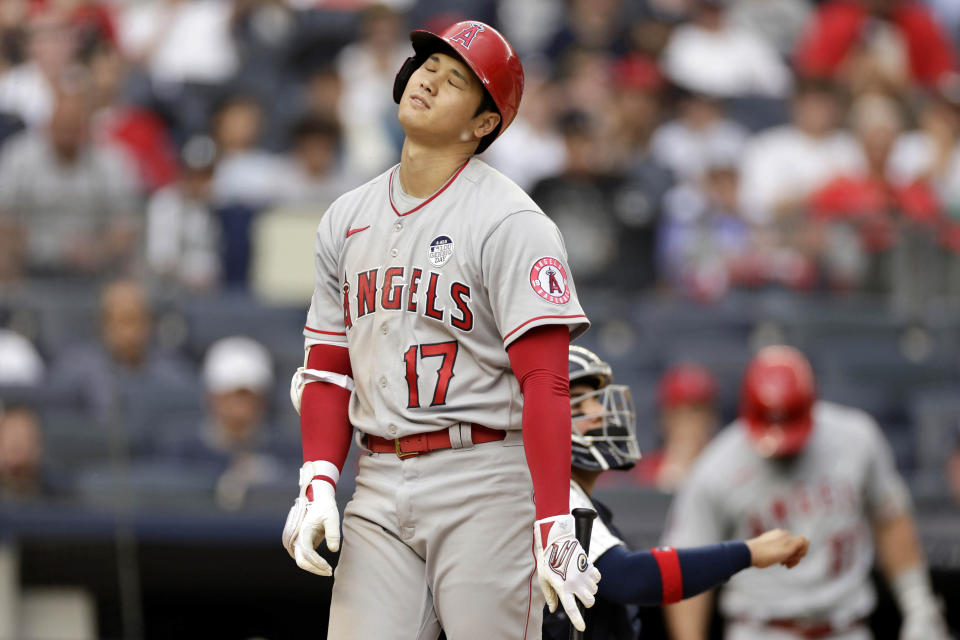 Los Angeles Angels' Shohei Ohtani reacts after being called out on strikes during the eighth inning of the first baseball game of a doubleheader against the New York Yankees on Thursday, June 2, 2022, in New York. (AP Photo/Adam Hunger)