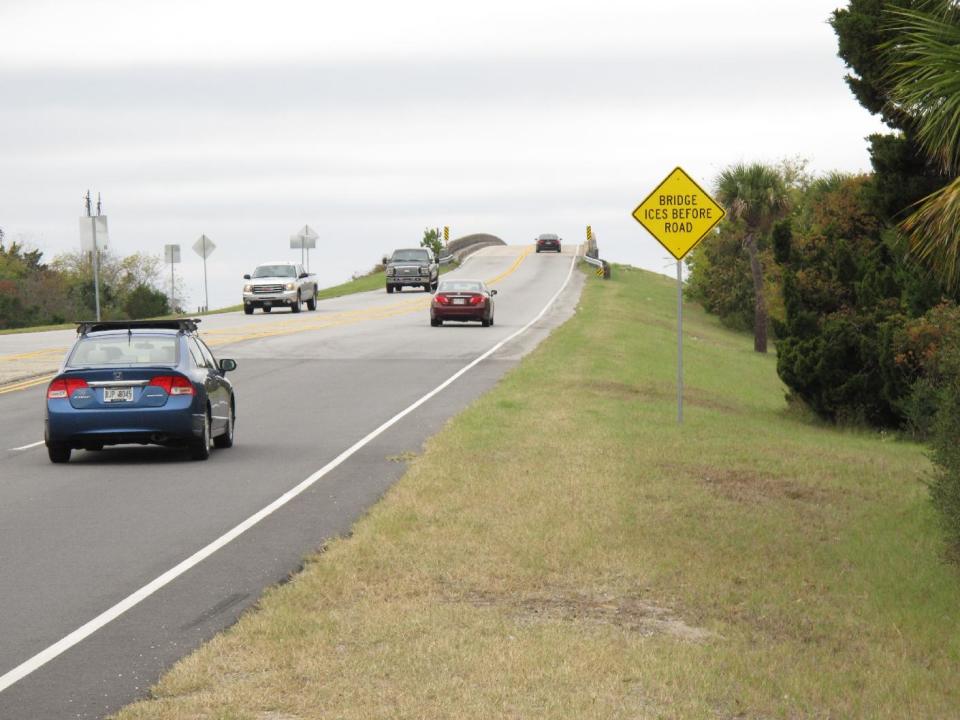 Cars and trucks cross the only bridge linking Tybee Island to the mainland on Wednesday, Nov. 20, 2013. Tybee Island officials have approved installing roadside scanners that read and store license plate information for every car and truck coming and going on the island. The mayor says the city wants the information for a tourism study, but officials are already getting angry calls and emails from residents who say tracking vehicles is too intrusive. (AP Photo/Russ Bynum)