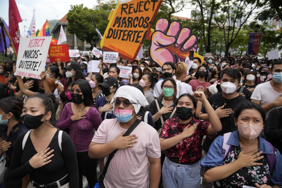 Students and activists sing during a rally in front of the office of the Commission on Elections as they question the results of the presidential elections in Manila, Philippines on Tuesday May 10, 2022. The namesake son of late Philippine dictator Ferdinand Marcos appeared to have been elected Philippine president by a landslide in an astonishing reversal of the 1986 "People Power" pro-democracy revolt that booted his father into global infamy. (AP Photo/Aaron Favila)