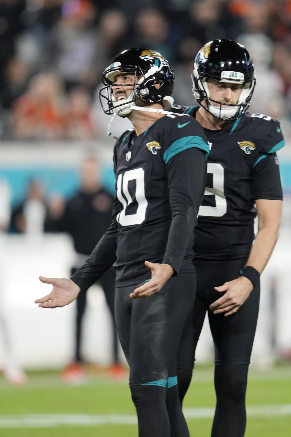Jacksonville Jaguars place-kicker Brandon McManus (10) reacts after missing a field goal during the second half of an NFL football game against the Cincinnati Bengals, Monday, Dec. 4, 2023, in Jacksonville, Fla. (AP Photo/John Raoux)