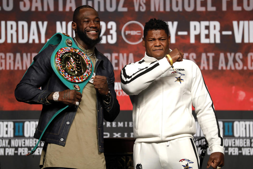 WBC heavyweight champion Deontay Wilder, left, and Luis Ortiz pose during a final news conference at MGM Grand Garden Arena in Las Vegas Wednesday, Nov. 20, 2019. The boxers will have a rematch at the arena on Saturday, Nov. 23, 2019. (Steve Marcus/Las Vegas Sun via AP)