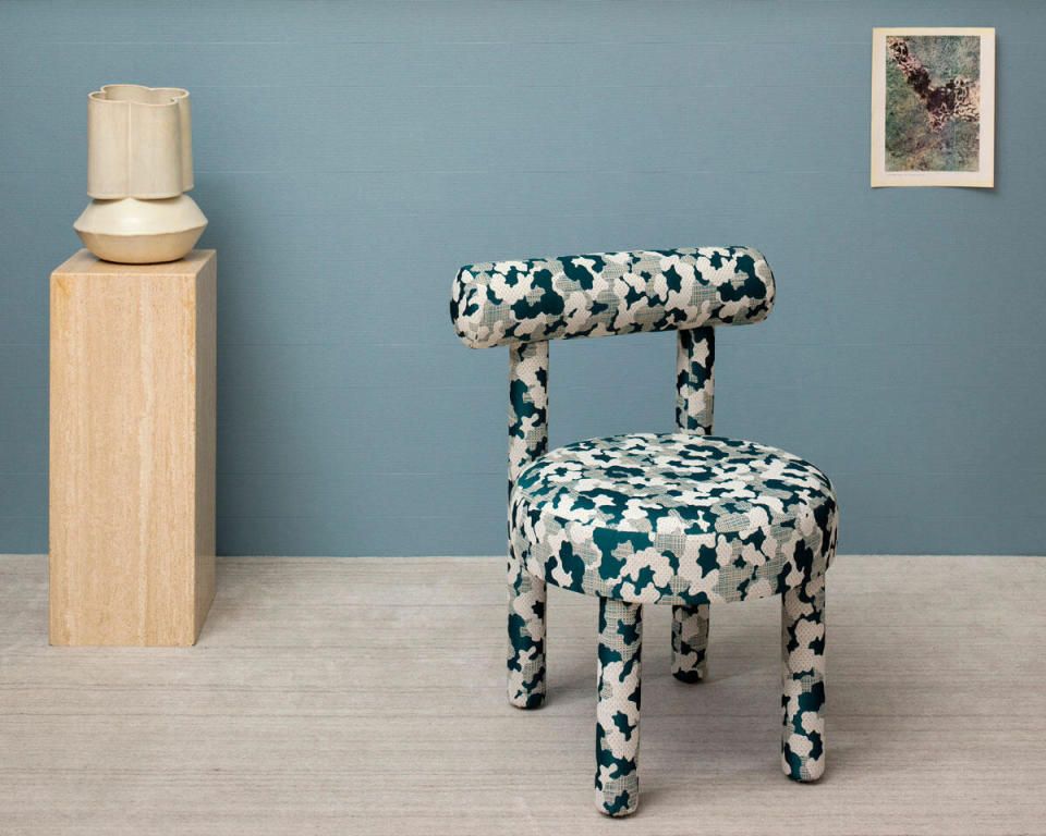 A chair upholstered in Mischief by Dorothy Cosonas for Wolf-Gordon