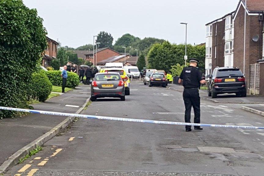 Police have cordoned off a street in Oldham after an armed man took a woman hostage: Iram Ramzan/Oldham Evening Chronicle