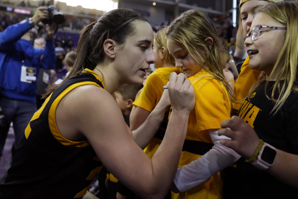 Iowa guard Caitlin Clark signs autographs after an NCAA college basketball game against Northern Iowa, Sunday, Nov. 12, 2023, in Cedar Falls, Iowa. Iowa won 94-53. (AP Photo/Charlie Neibergall)