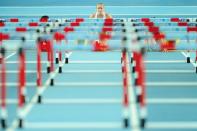 Australia's Sally Pearson (C) settles into the blocks at the start of the women's 60m hurdles final at the 2012 IAAF World Indoor Athletics Championships at the Atakoy Athletics Arena in Istanbul. (AFP Photo/Aris Messinis)