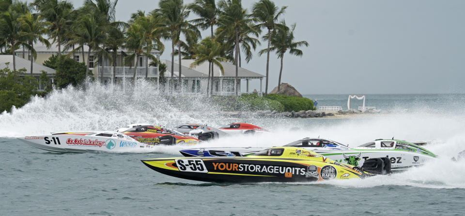 In this photo provided by the Florida Keys News Bureau, Super Stock-class boats cross the start line Friday, Nov. 12, 2021, during the second of three competition days at the Race World Offshore Key West Championships in Key West, Fla. The final race day for some 50 entries divided into multiple classes is set for Sunday, Nov. 14. (Rob O'Neal/Florida Keys News Bureau via AP)
