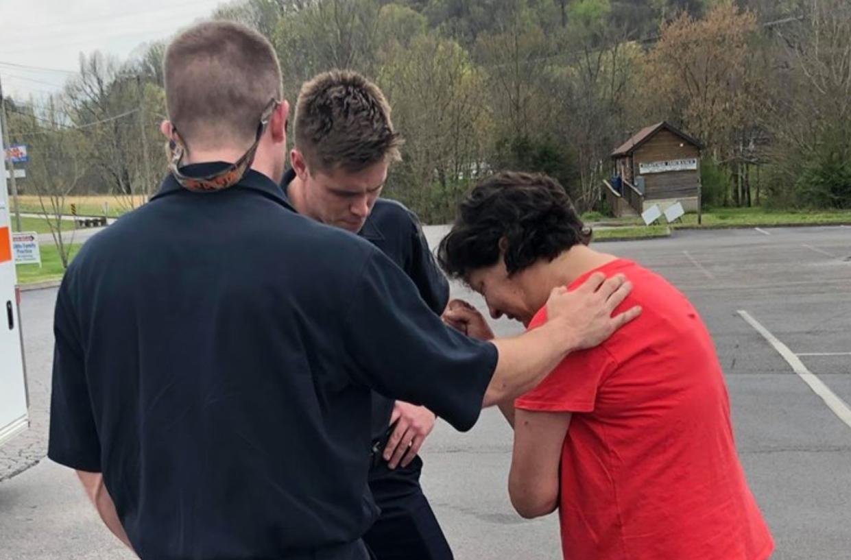 First responders with Knox County Rural Metro stopped immediately to pray with a woman who needed comfort. (Photo: Facebook)