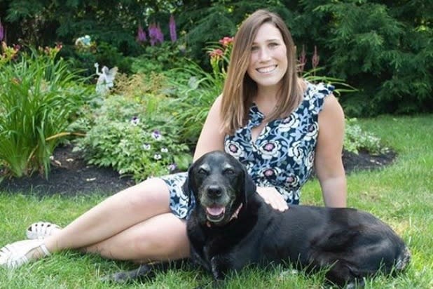 Doctor Adeline Fagan pictured with a dog before she died from COVID-19. 