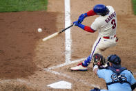 Philadelphia Phillies' Bryce Harper hits a two-run home run off Toronto Blue Jays pitcher Robbie Ray during the fifth inning of the first baseball game in a doubleheader, Friday, Sept. 18, 2020, in Philadelphia. (AP Photo/Matt Slocum)