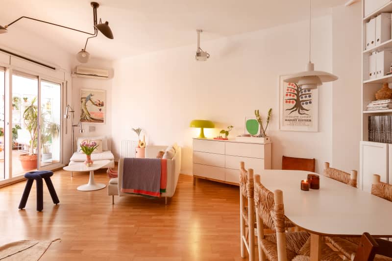 White large living and dining area with large windows