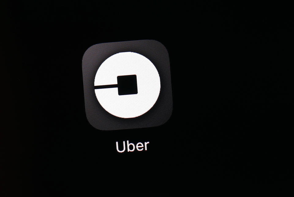 FILE - This March 20, 2018, file photo shows the Uber app on an iPad in Baltimore. Uber is providing a look under the hood of its business in the lead-up to its hotly anticipated debut on the stock market. Documents released Thursday, April 11, 2019, offered the most detailed view of the world’s largest ride-hailing service since its inception a decade ago. (AP Photo/Patrick Semansky, File)