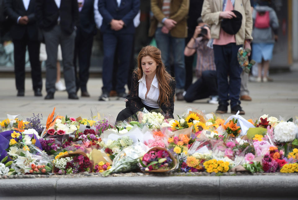 <p>A woman reacts next to flowers left on the south side of London Bridge near Borough Market after an attack left 7 people dead and ozens of injured in London, Britain, June 5, 2017. (Photo: Clodagh Kilcoyne/Reuters) </p>