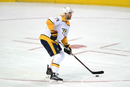 Nov 10, 2018; Dallas, TX, USA; Nashville Predators defenseman Mattias Ekholm (14) moves the puck during the third period against the Dallas Stars at American Airlines Center. Shanna Lockwood-USA TODAY Sports