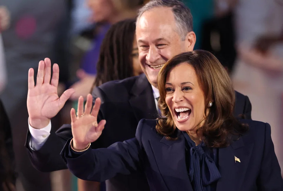 Vice President and 2024 Democratic presidential candidate Kamala Harris and her husband US Second Gentleman Douglas Emhoff wave from the stage on the fourth and last day of the Democratic National Convention (DNC) at the United Center in Chicago, Illinois, on August 22, 2024.