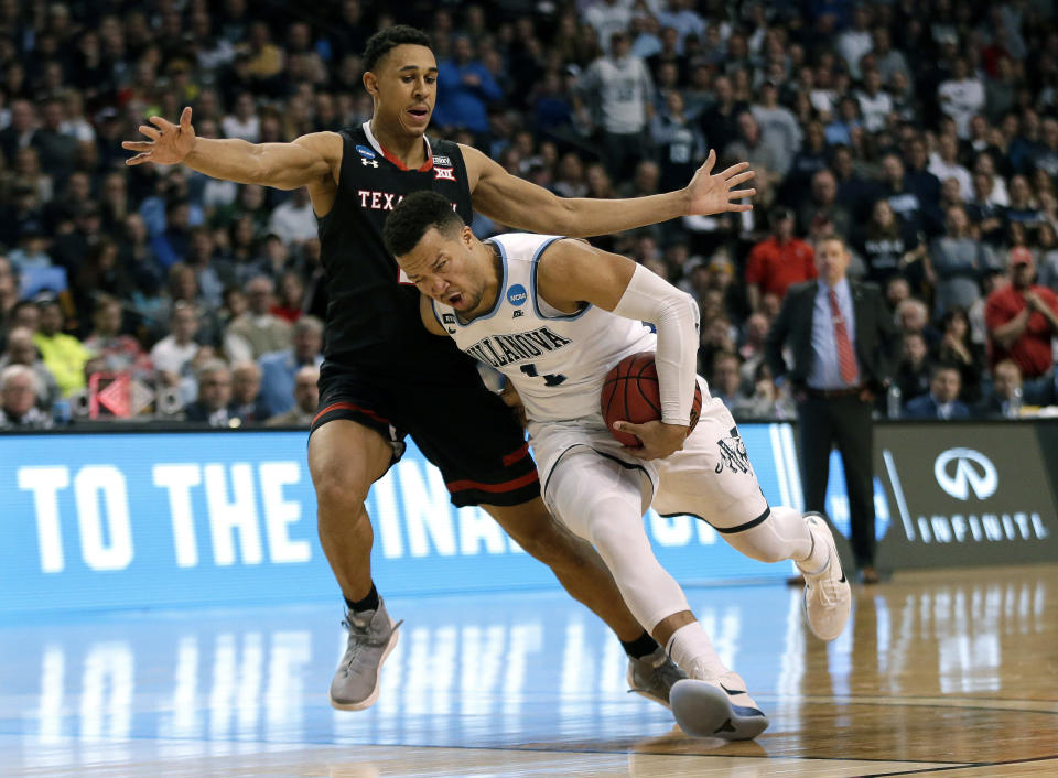 Villanova’s Jalen Brunson (front) drives past Texas Tech’s Zhaire Smith during the Wildcats’ victory. (AP)