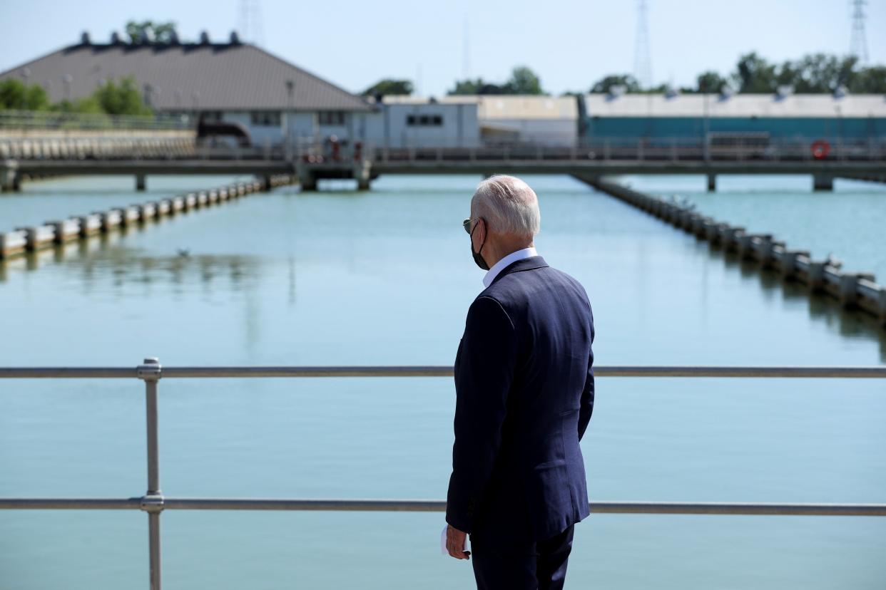 <p>Joe Biden looks out at the New Orleans Sewerage & Water Board’s facility on 6 May.</p> (REUTERS)