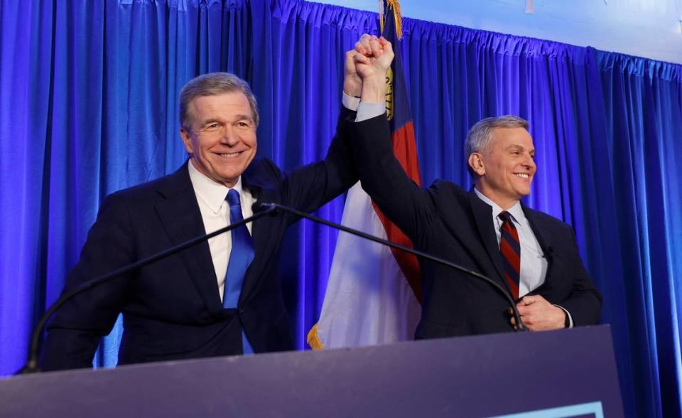 N.C. Gov. Roy Cooper celebrates with Attorney General Josh Stein after Stein won the Democratic primary for governor. The two celebrated during a North Carolina Democrats primary election night party at Maywood Hall and Gardens in Raleigh Tuesday, March 5, 2024.