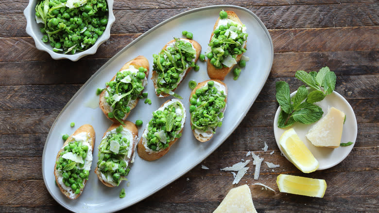 Green pea crostini on plate