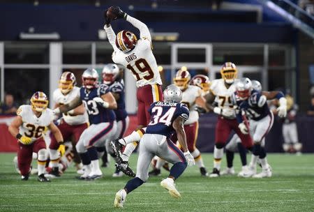 Aug 9, 2018; Foxborough, MA, USA; Washington Redskins wide receiver Robert Davis (19) catches a pass in front of New England Patriots defensive back JC Jackson during the first half at Gillette Stadium. Bob DeChiara-USA TODAY Sports