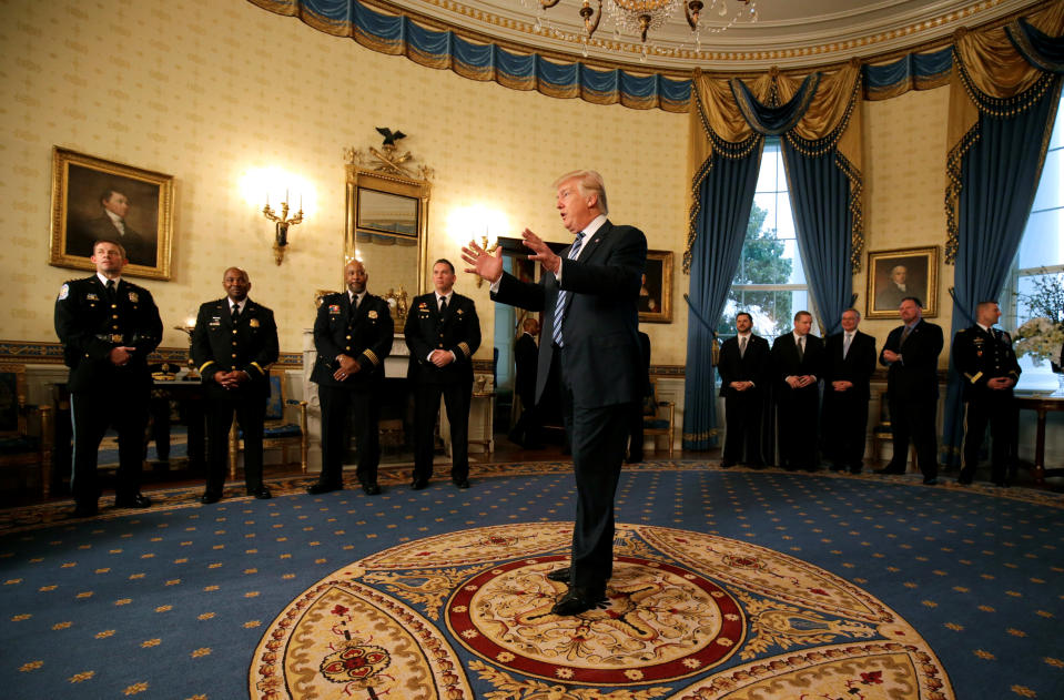 U.S. President Donald Trump speaks during the Inaugural Law Enforcement Officers and First Responders Reception in the Blue Room of the White House in Washington, U.S., January 22, 2017. REUTERS/Joshua Roberts