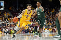 Minnesota guard Payton Willis (0) drives past Michigan State guard Tyson Walker during the first half an NCAA college basketball game Wednesday, Dec. 8, 2021, in Minneapolis. (AP Photo/Craig Lassig)