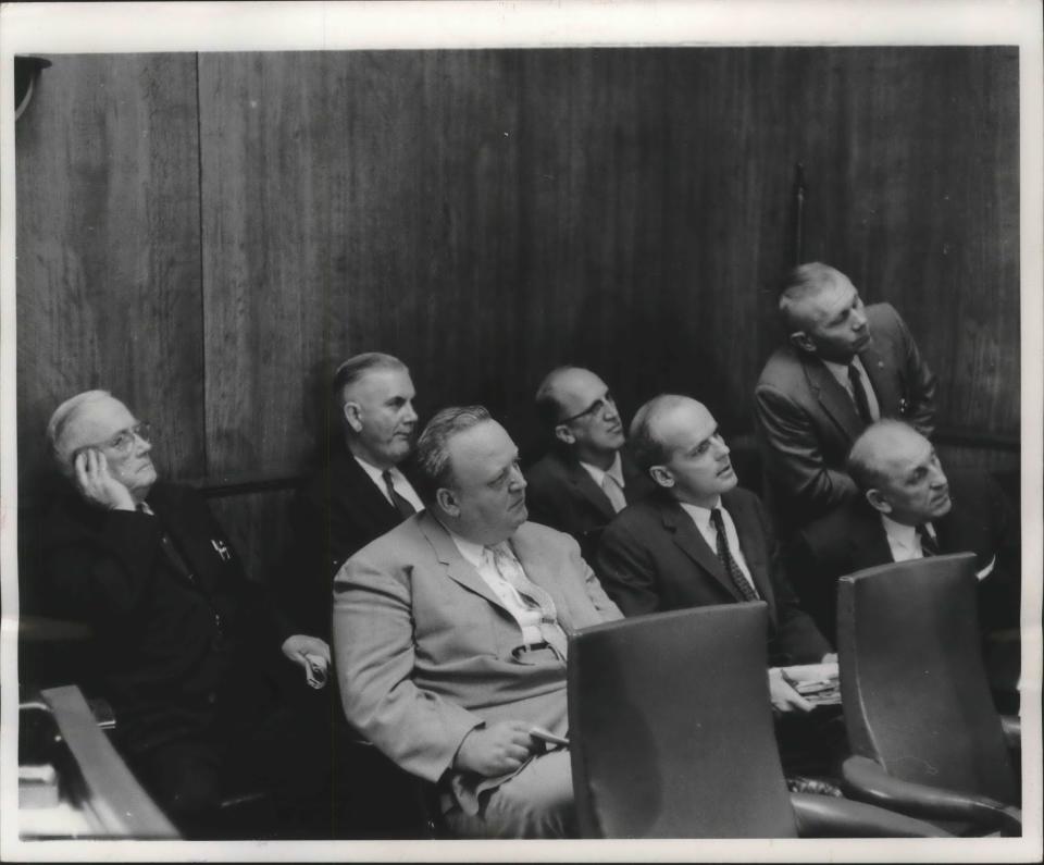 Wisconsin government officials and others gather to hear Air Force Secretary James H. Douglas discuss the closing of Richard Bong Air Force Base in Racine on Oct. 8, 1959. Among them, front row, from left: U.S. Rep. Gerald Flynn (D-Racine), U.S. Sen. William Proxmire (D-Wisconsin) and George Schlitz, chairman of the Kenosha County Board. Back row, from left: U.S. Sen. Alexander Wiley (R-Wisconsin), Racine Mayor Jack H. Humble, state Sen. Lynn Stalbaum (D-Racine) and Phil Warren, chairman of the Burlington town board.