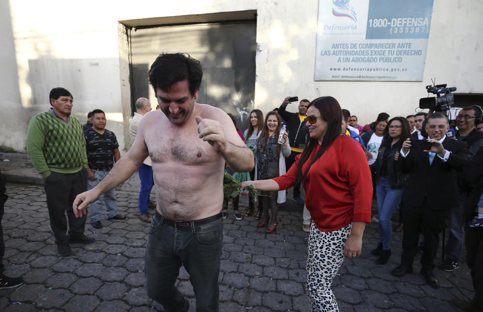 U.S. citizen Paul Ceglia does a dance typically performed by people released from jail in Quito, Ecuador, Tuesday, June 11, 2019. Ecuador released the New York man and turned down an extradition request from the United States, where he was arrested after falsely claiming he was owed half-ownership of Facebook. (AP Photo/Soledad Nunez)