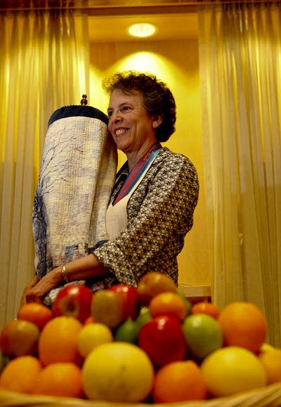 <span class="caption">Rabbi Laura Geller holds the Torah in a synagogue in Beverly Hills, California, as she discusses Shavuot.</span> <span class="attribution"><a class="link " href="https://www.gettyimages.com/detail/news-photo/rabbi-laura-geller-poses-for-a-portrait-holding-the-torah-news-photo/566037751?adppopup=true" rel="nofollow noopener" target="_blank" data-ylk="slk:Anne Cusack/Los Angeles Times via Getty Images;elm:context_link;itc:0;sec:content-canvas">Anne Cusack/Los Angeles Times via Getty Images</a></span>