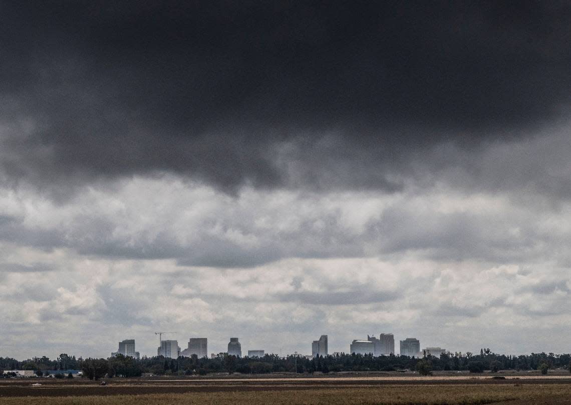 Rain clouds roll past the Sacramento skyline as seen from the Garden Highway near San Juan Road on Monday, Sept. 19, 2022. Hector Amezcua/hamezcua@sacbee.com