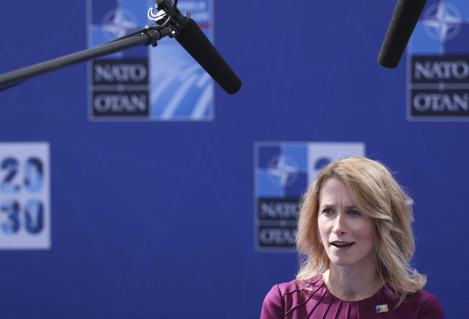 Estonia's Prime Minister Kaja Kallas speaks with the media as she arrives for a NATO summit at NATO headquarters in Brussels, Monday, June 14, 2021. U.S. President Joe Biden is taking part in his first NATO summit, where the 30-nation alliance hopes to reaffirm its unity and discuss increasingly tense relations with China and Russia, as the organization pulls its troops out after 18 years in Afghanistan. (Kenzo Tribouillard, Pool via AP)