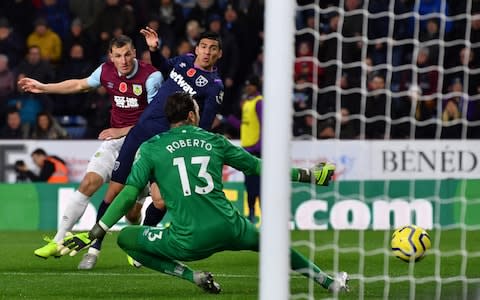 West Ham United's Spanish goalkeeper Roberto saves an effort from Burnley's New Zealand striker Chris Wood  - Credit: AFP