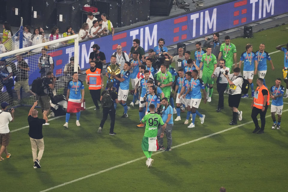 Napoli's players celebrate after winning the Serie A soccer title trophy at the Diego Maradona Stadium, in Naples, Sunday, June 4, 2023. (AP Photo/Andrew Medichini)