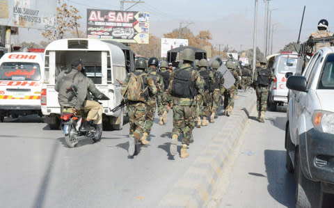 Pakistan security forces take measures after a suicide attack at Bethel Memorial Methodist Church in Quetta