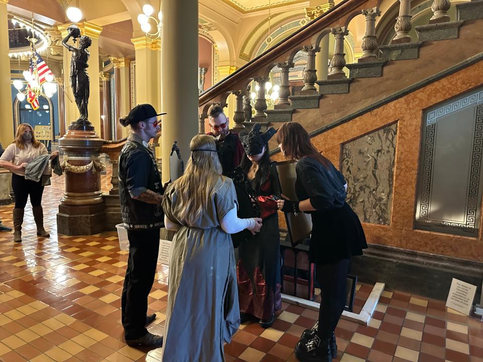 Members of the Temple of Satan gather for a closing ceremony in the Capitol.