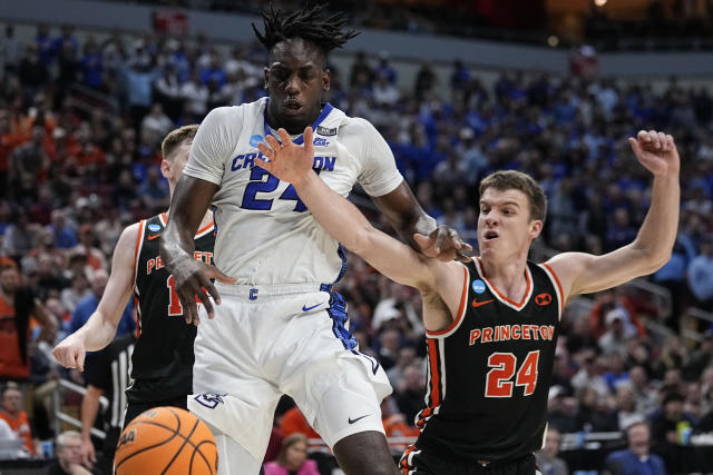 Creighton forward Arthur Kaluma (24) loses the ball against Princeton guard Blake Peters (24) in the second half of a Sweet 16 round college basketball game in the South Regional of the NCAA Tournament, Friday, March 24, 2023, in Louisville, Ky. (AP Photo/John Bazemore)
