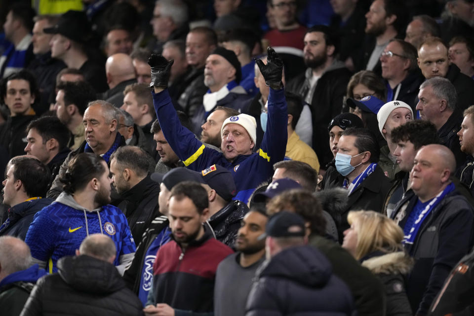 Chelsea supporters in the standing section ahead of the English Premier League soccer match between Chelsea and Liverpool at Stamford Bridge in London, Sunday, Jan. 2, 2022. It is the first time standing sections have been allowed at Premier League stadiums since 1994. Chelsea is one of the clubs allowed by British authorities to take part in a pilot scheme that will allow some clubs to trial licensed standing areas from this month. (AP Photo/Matt Dunham)