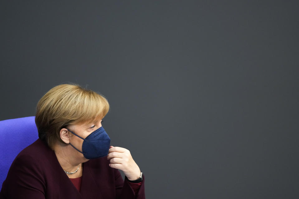 FILE - German Chancellor Angela Merkel attends a debate about the measures to battle the coronavirus and COVID-19 at the parliament Bundestag in Berlin, Germany, Nov. 11, 2021. Chancellor Angela Merkel on Saturday called on all unvaccinated Germans to get their shots as quickly as possible as the country’s coronavirus infection rate hits the latest in a string of new highs and death numbers are growing. (Photo/Markus Schreiber, File)