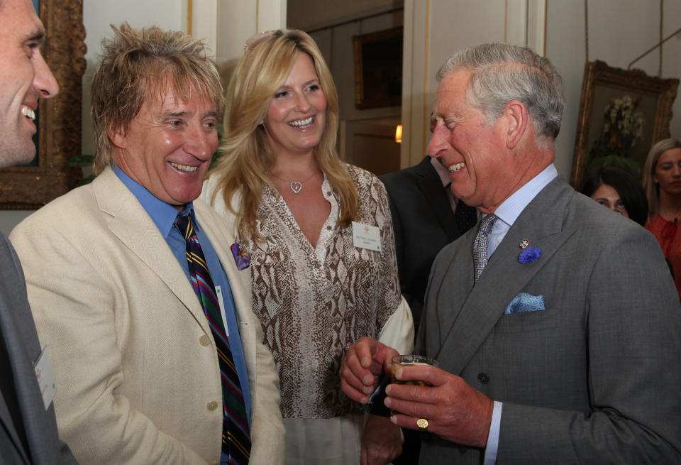 Rod Stewart and Penny Lancaster are greeted by Prince Charles, Prince of Wales at The Prince's Trust 35th Anniversary Reception at Clarence House on July 8, 2011 in London, England.  (Photo by Tim Whitby/Getty Images)