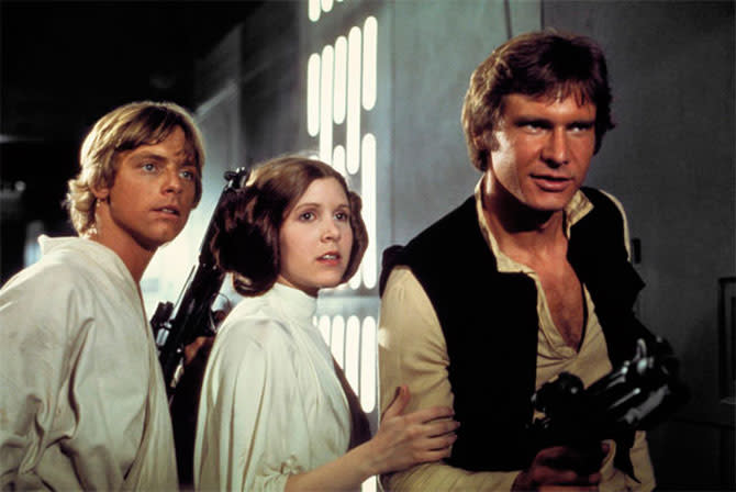 Mark Hamill, Carrie Fisher, and Harrison Ford in <em>Star Wars.</em> (Photo: Lucasfilm)