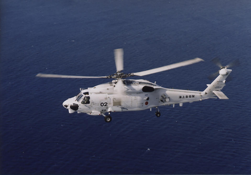 This undated photo released by and taken from the official website of the Japan Maritime Self-Defense Force, shows a SH-60K chopper. Two Japanese navy helicopters of the same type crashed in the Pacific Ocean south of Tokyo during a nighttime training flight after possibly colliding with each other, the country's defense minister said Sunday, April 21, 2024. (The official website of the Japan Maritime Self-Defense Force via AP)