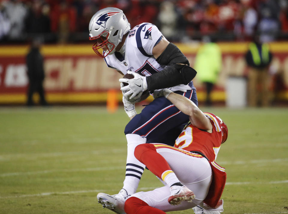New England Patriots tight end Rob Gronkowski (87) is tackled by Kansas City Chiefs defensive back Daniel Sorensen (49) during the first half of the AFC Championship NFL football game, Sunday, Jan. 20, 2019, in Kansas City, Mo. (AP Photo/Charlie Riedel)