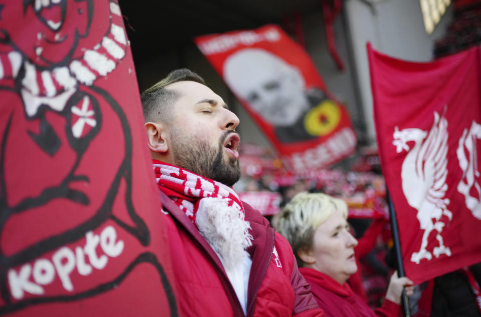 Liverpool fans cheer their team during the English Premier League soccer match between Liverpool and Southampton at Anfield stadium in Liverpool, England, Saturday, Nov. 12, 2022. (AP Photo/Jon Super)