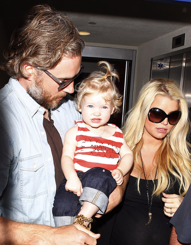 Pregnant Jessica Simpson and family arriving on a flight at LAX