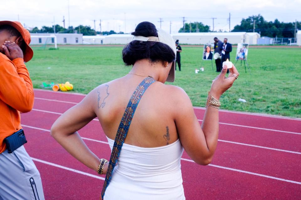 The Austin Honey Badgers Track Club, a nonprofit for young runners, was the host of Thursday's vigil on the track at Webb Middle School for Lyndsey Vicknair.